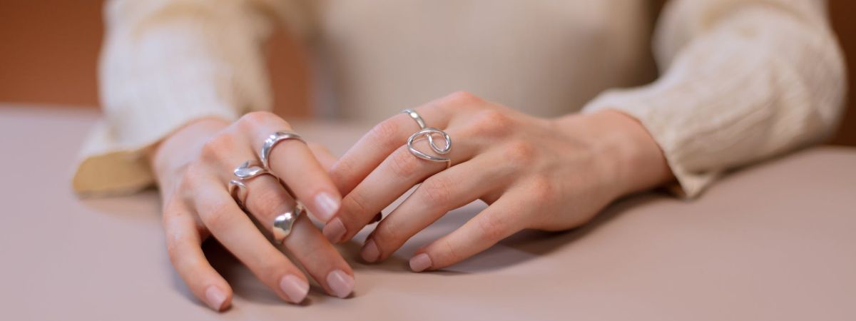 925 Sterling Silver - All You Need To Know 1 close up photo of a person wearing silver rings