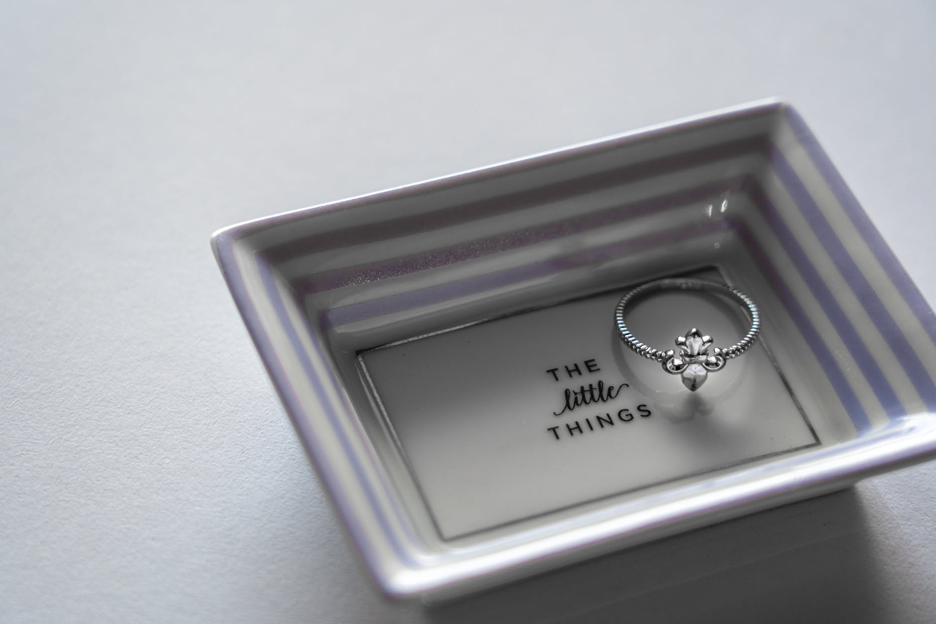 silver ring on tray